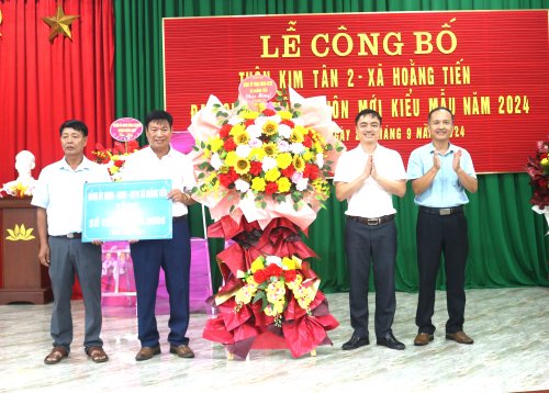 A group of men standing in front of a large bouquet of flowers

Description automatically generated